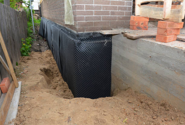 Happy homeowners after waterproofing job in Mays Landing